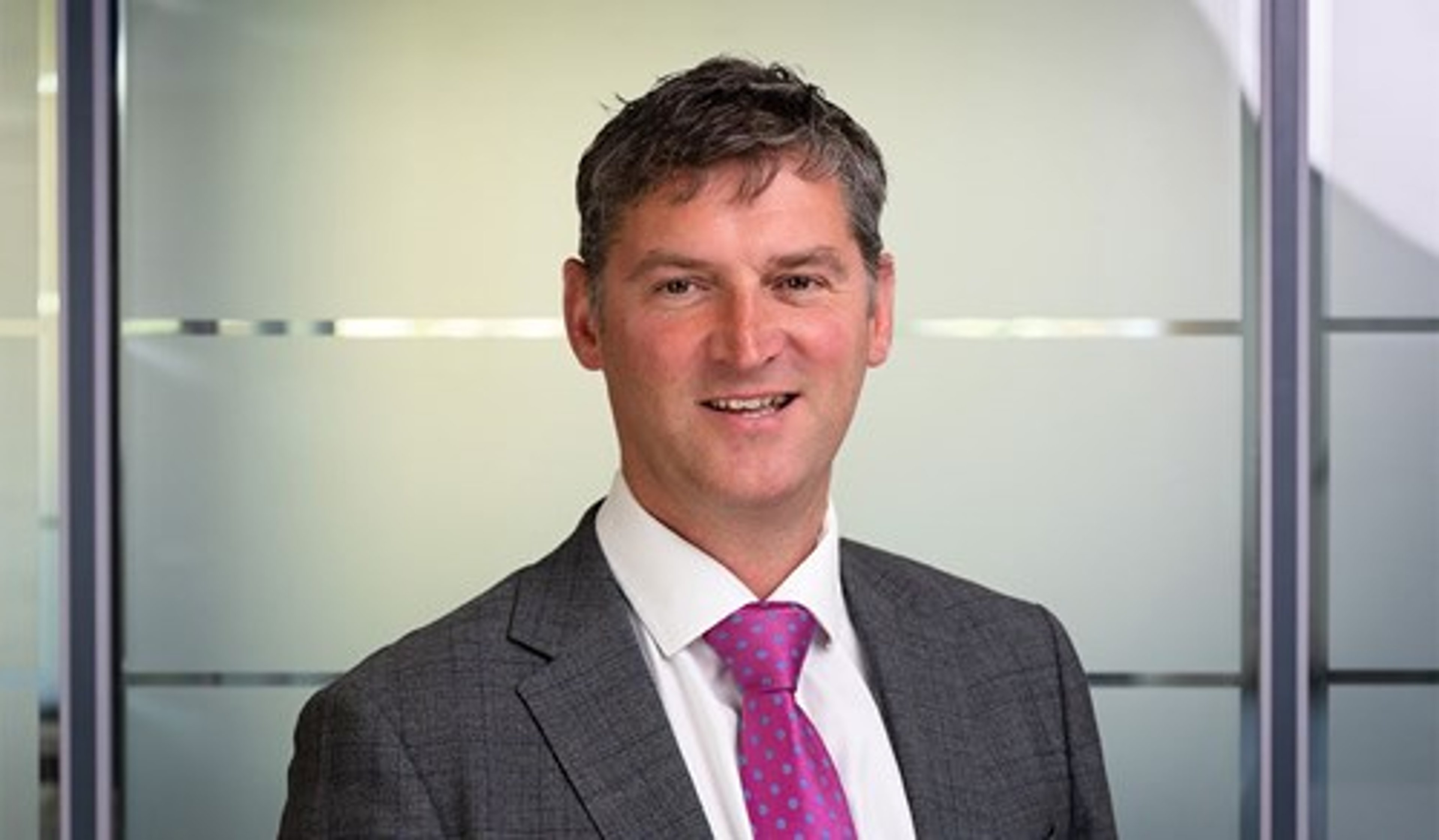 A headshot of Graeme Reid